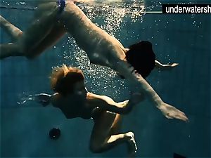 two super-sexy amateurs displaying their bodies off under water